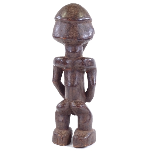 81 - A Baule carved and stained wood Ancestor figure, height 34cm