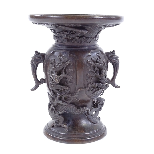 82 - A Japanese patinated bronze vase with cast dragon entwined body, signed under base, height 13.5cm