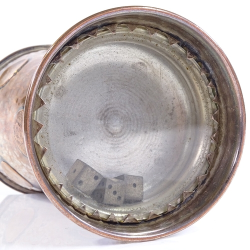 83 - An unusual silver plate on copper gaming cup, with inset coins and dice behind glass panel under the... 