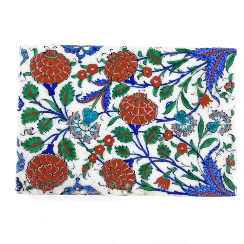 88 - A Turkish painted pottery tile, 16cm x 24cm