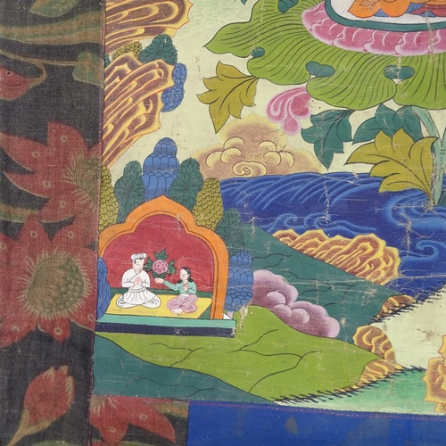 94 - A Chinese hand painted thangka depicting a seated Buddha, in floral textile border, 68cm x 50cm