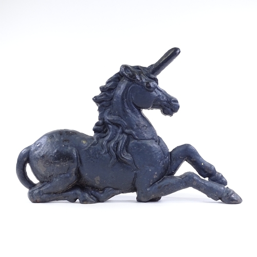 99 - A Victorian cast-iron unicorn design fire ornament, length 57cm