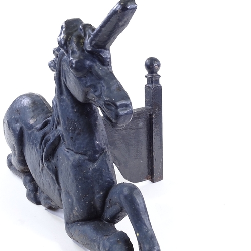 99 - A Victorian cast-iron unicorn design fire ornament, length 57cm