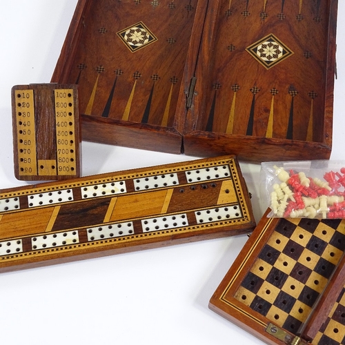 139 - A group of Victorian games boxes and cribbage markers