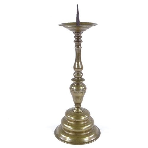 148 - A 17th century bronze pricket candle stand, height overall 44cm