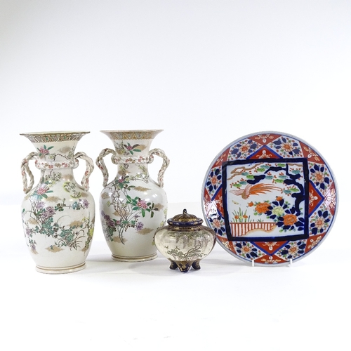 157 - A pair of Oriental porcelain vases, with rope design handles and painted flowers, height 27cm, a Sat... 