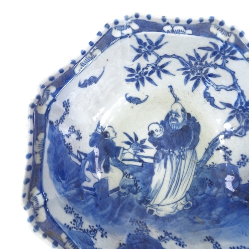 163 - A Chinese blue and white porcelain octagonal bowl with hand painted figures in gardens, 25cm across