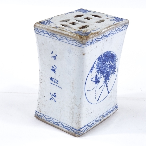 164 - A Chinese blue and white porcelain pillow, with hand painted decoration and text, length 16cm