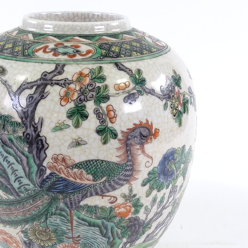 165 - A Chinese porcelain jar with hand painted exotic bird, height 25cm