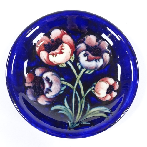 169 - A Moorcroft Pottery tulip-design dish, 19cm across