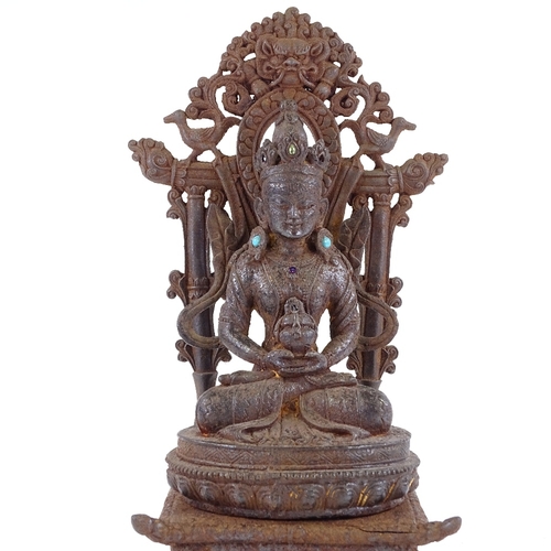 171 - A Chinese cast-iron seated Buddha and shrine with inset turquoise stones, height 35cm