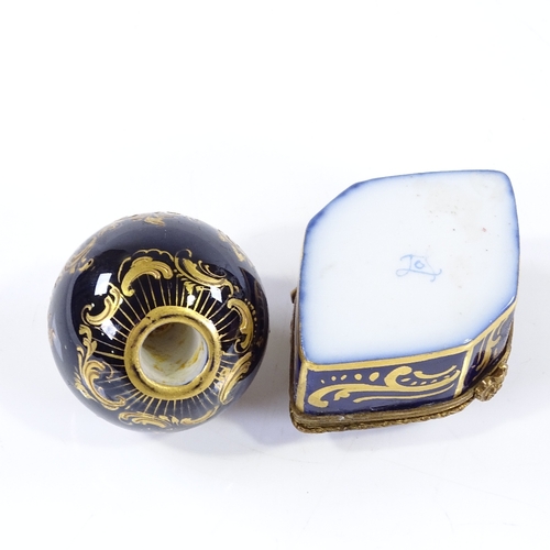 172 - A painted and gilded porcelain globular parasol handle, diameter 4cm, and a French painted porcelain... 