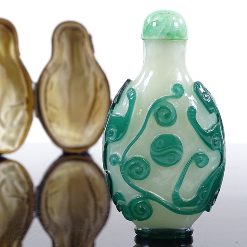 189 - An Antique Chinese 2-colour overlay cameo glass snuff bottle, decorated with beasts, with jade-mount... 