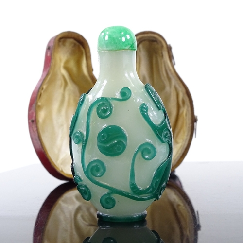 189 - An Antique Chinese 2-colour overlay cameo glass snuff bottle, decorated with beasts, with jade-mount... 