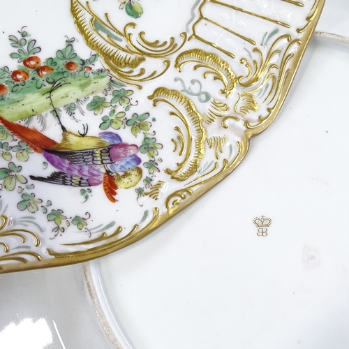 196 - A pair of 19th Continental porcelain plates, with relief-moulded hand painted and gilded exotic bird... 