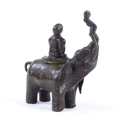 199 - A Chinese patinated bronze incense burner, in the form of a figure seated on an elephant, height 20c... 