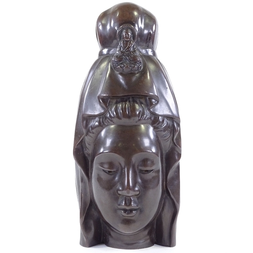 200 - A patinated bronze Buddha head, height 30cm