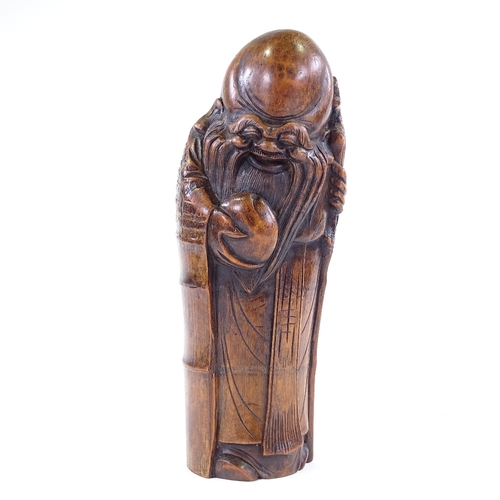 201 - A Chinese carved bamboo figure of Shung Lau holding an eternal peach, height 40cm