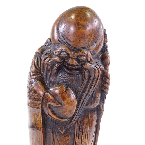 201 - A Chinese carved bamboo figure of Shung Lau holding an eternal peach, height 40cm