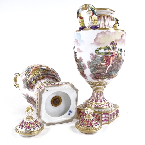 205 - A pair of Naples porcelain 2-handled vases and covers, with relief-moulded hand painted and gilded C... 