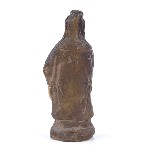 209 - A Chinese terracotta standing figure with traces of green glaze, height 12cm