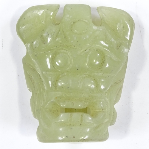 218 - A Chinese carved jade mask buckle, height 5.5cm