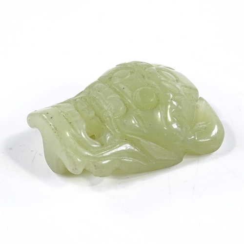 218 - A Chinese carved jade mask buckle, height 5.5cm