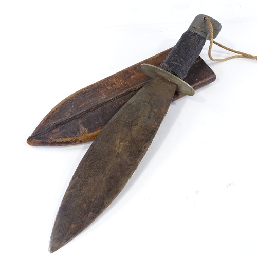 229 - A Second War Period British Commando machete with broad blade and original rubber handle, in leather... 