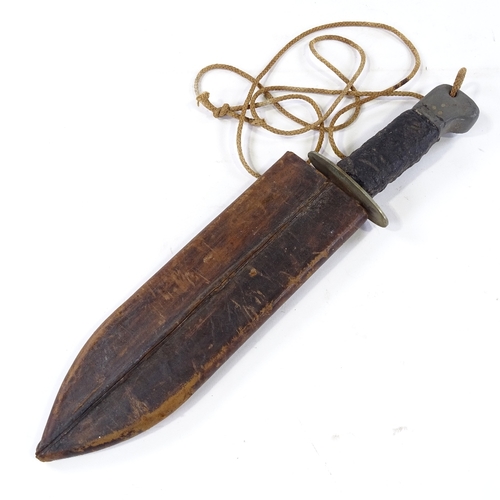 229 - A Second War Period British Commando machete with broad blade and original rubber handle, in leather... 