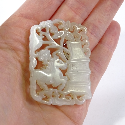 242 - A Chinese carved and pierced jade pendant, length 5cm