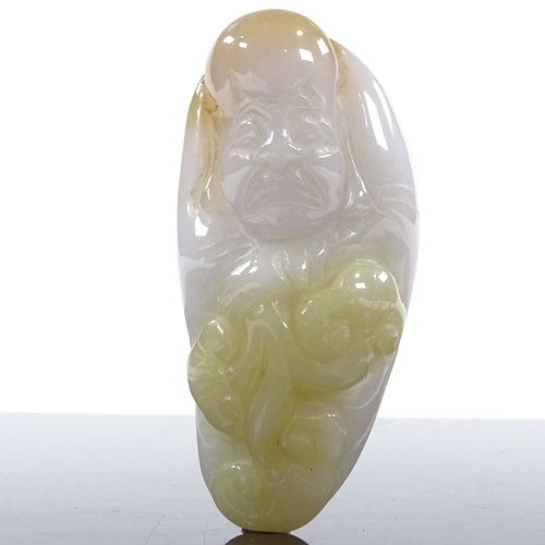 244 - A Chinese relief carved jade reclining figure, length 8cm