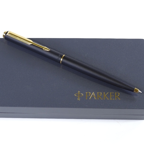 253 - A Parker ballpoint pen, matte black/gold, new and boxed