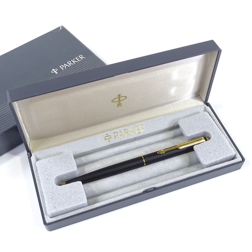 253 - A Parker ballpoint pen, matte black/gold, new and boxed