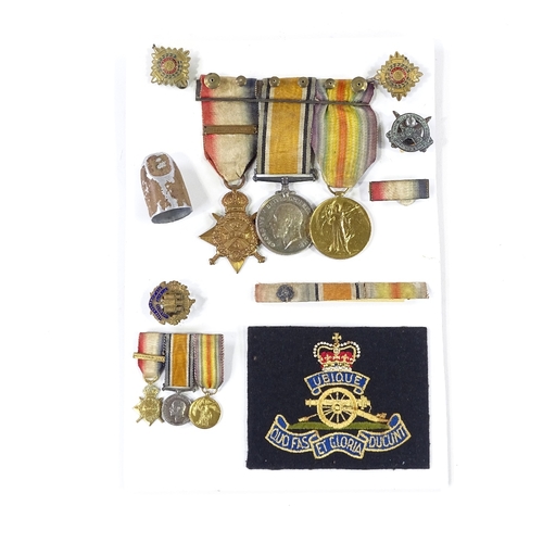 274 - A trio of First War Service medals awarded to 43362 Gnr Anthony Cecil Scott RHA, including miniature... 