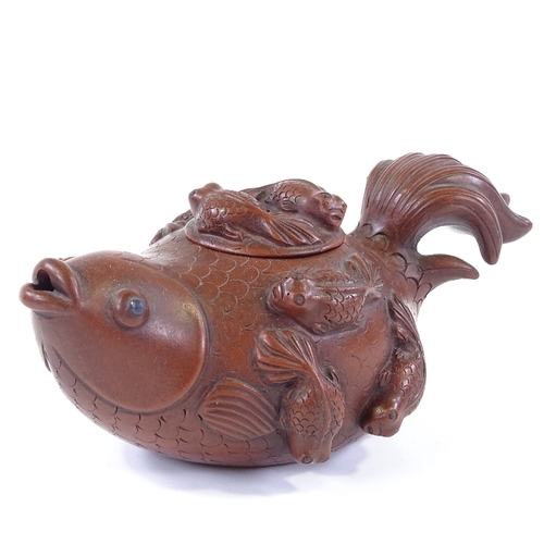 292 - A Chinese Yixing red ware Koi carp design teapot, length 17cm