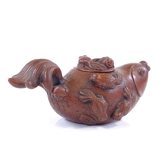 292 - A Chinese Yixing red ware Koi carp design teapot, length 17cm