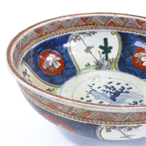 297 - A Chinese porcelain bowl with painted decoration, diameter 29cm