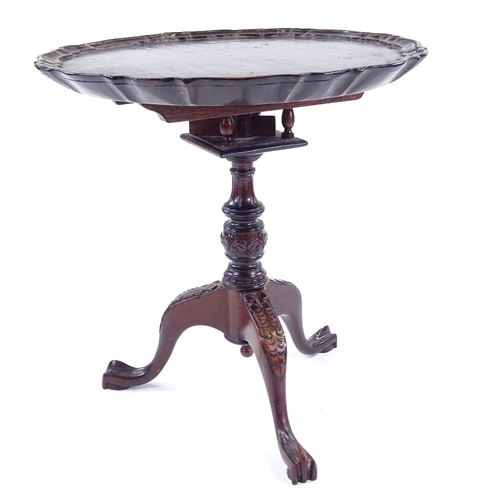 307 - A miniature mahogany tilt-top table on carved tripod base, 30cm across