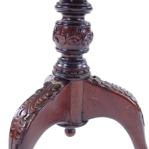 307 - A miniature mahogany tilt-top table on carved tripod base, 30cm across