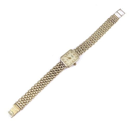 404 - ROTARY - a lady's 9ct gold quartz wristwatch, champagne dial with gilded baton hour markers on 9ct b... 