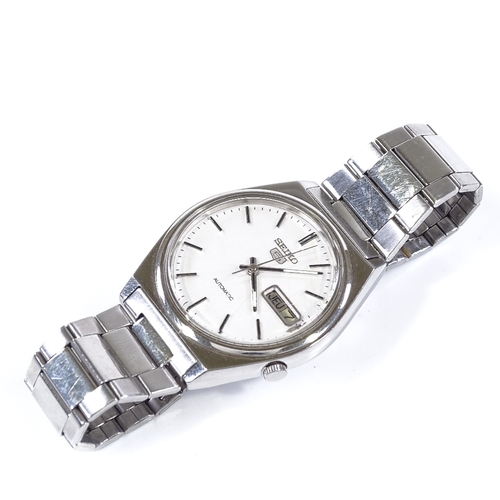 416 - SEIKO 5 - a stainless steel automatic wristwatch, silvered dial with baton hour markers and day date... 