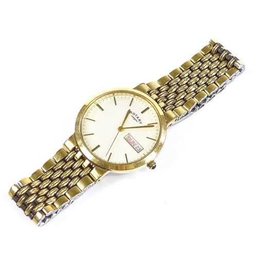 417 - ROTARY - a gold plated quartz wristwatch, cream dial with gilded baton hour markers and day date ape... 