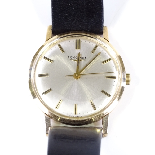 424 - LONGINES - a 9ct gold mechanical wristwatch, silvered dial with baton hour markers and original stra... 