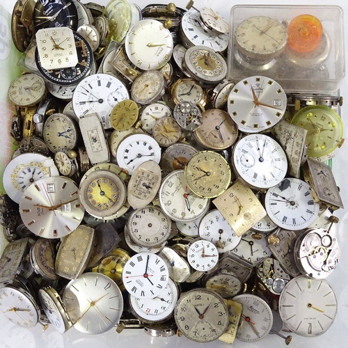 447 - A large collection of various wristwatch movements, including Cyma, Doxa, Bulova etc