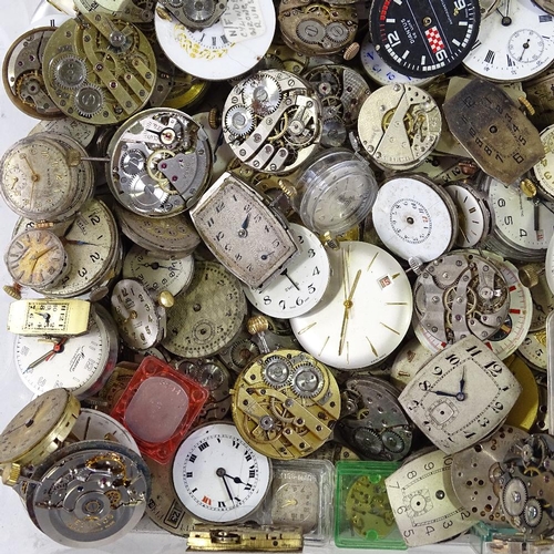 447 - A large collection of various wristwatch movements, including Cyma, Doxa, Bulova etc