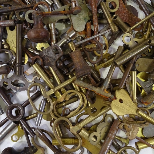 460 - A large quantity of various clock keys, including some with turned wood handles