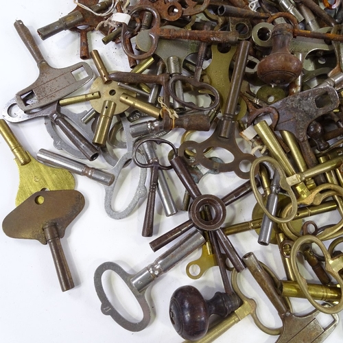 460 - A large quantity of various clock keys, including some with turned wood handles