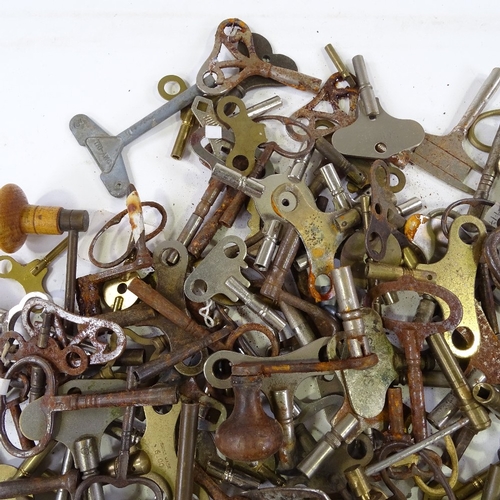 460 - A large quantity of various clock keys, including some with turned wood handles