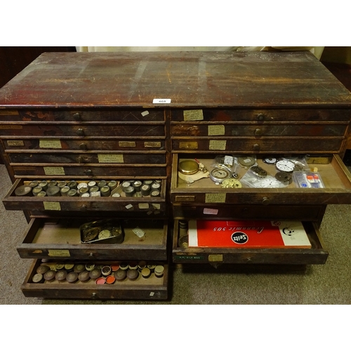 468 - HOROLOGY INTEREST - a watchmaker's double-bank chest of drawers and contents, including parts, movem... 