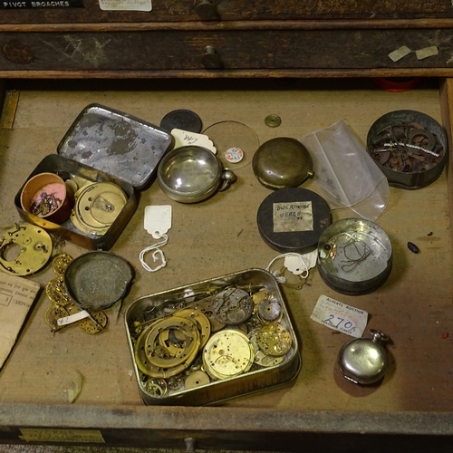 468 - HOROLOGY INTEREST - a watchmaker's double-bank chest of drawers and contents, including parts, movem... 